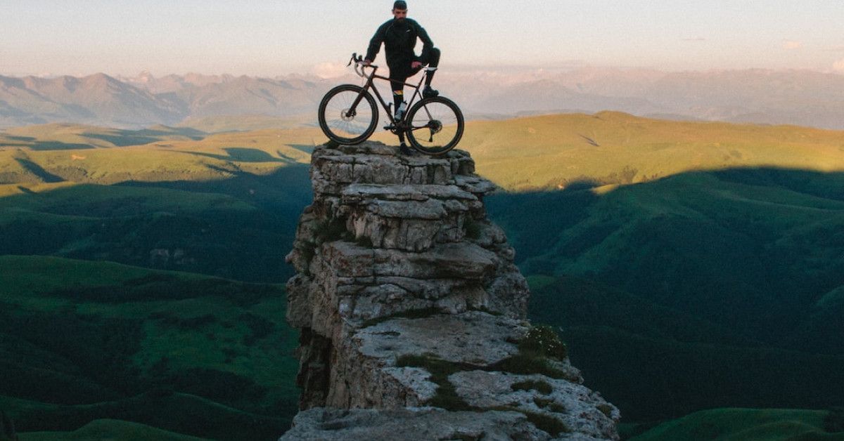 "Cyclist wearing helmet and safety gear for protective riding."